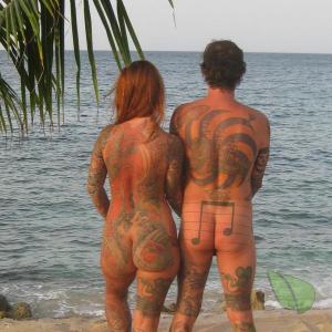 Solo nudists all tattooed up in the wilderness