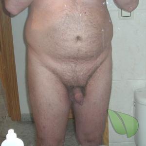 Solo nudist sitting at home