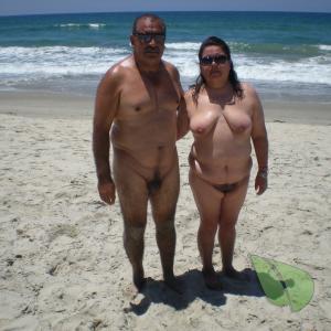 A nude person in the sand