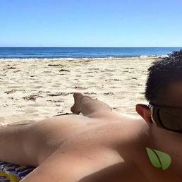 A nudist enjoying the sun