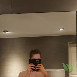 Solo nudist posing in their house
