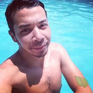 A dude relaxing in the water outdoors