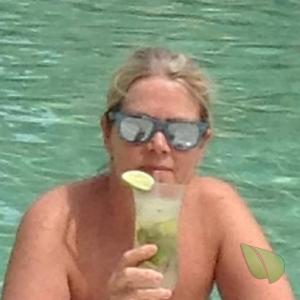Solo woman having fun in the water in nature