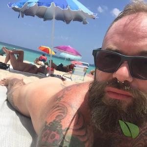 Solo man rocking tattoos out and about