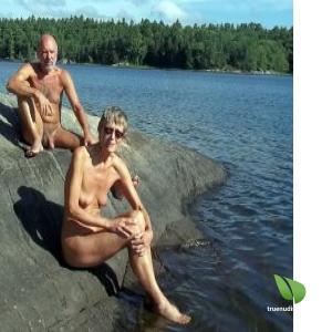 One nude couple outdoors