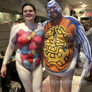 a crowd of nude person covered in bodypaint