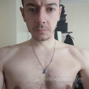 One nudist having fun at home