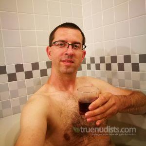 One nudist relaxing at home