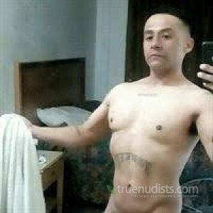 One nudist posing in their house