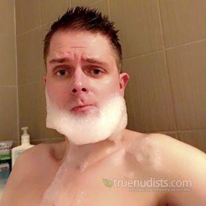 One nudist having fun at home