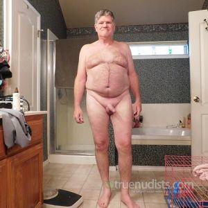 One dude posing in their house