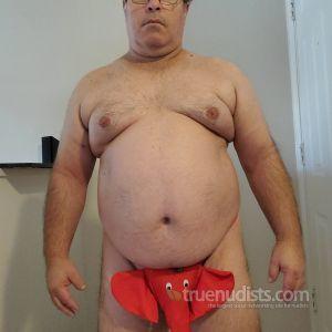 A dude posing in their house