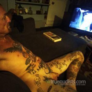 Solo male rocking tattoos in their home