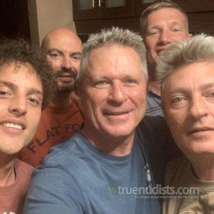 a crowd of friends relaxing at home