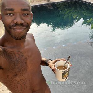 A guy with cool tattoos outside