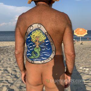 A man wearing fun bodypaint out and about